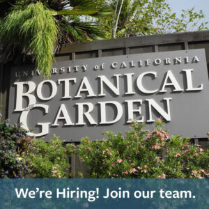 A photo of the Botanical Garden entrance sign surrounded by plants with text reading: We're Hiring. Join our team.