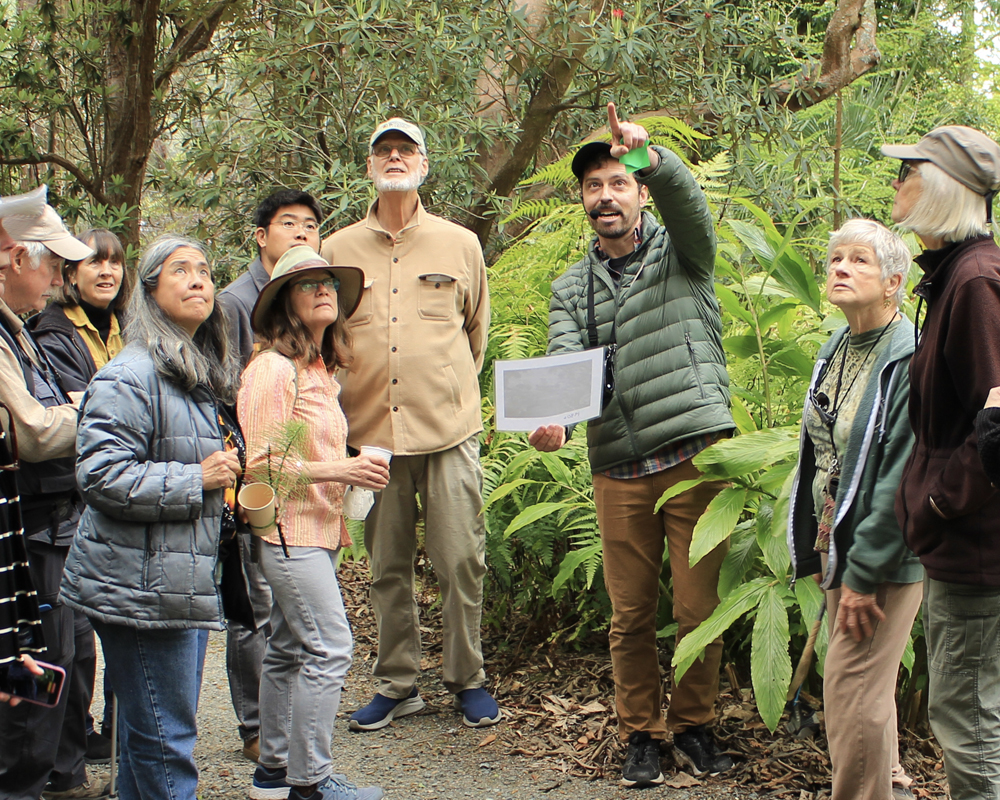 Visitors learn about the garden during a tour