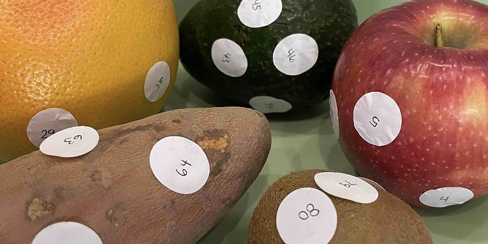 Fruit and vegetables with numbered labels stuck on the skin