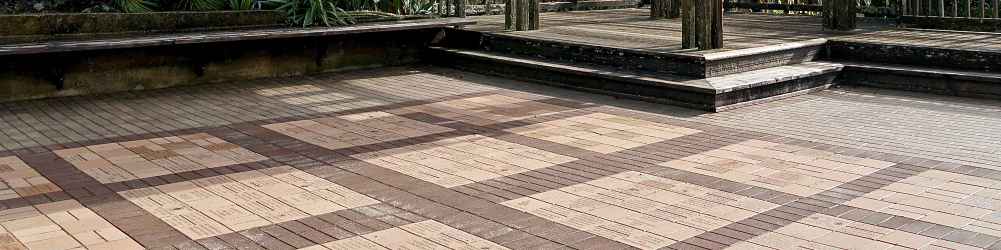 An outdoor plaza with inlaid and etched bricks