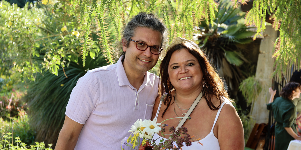 A smiling couple at a party in the Garden