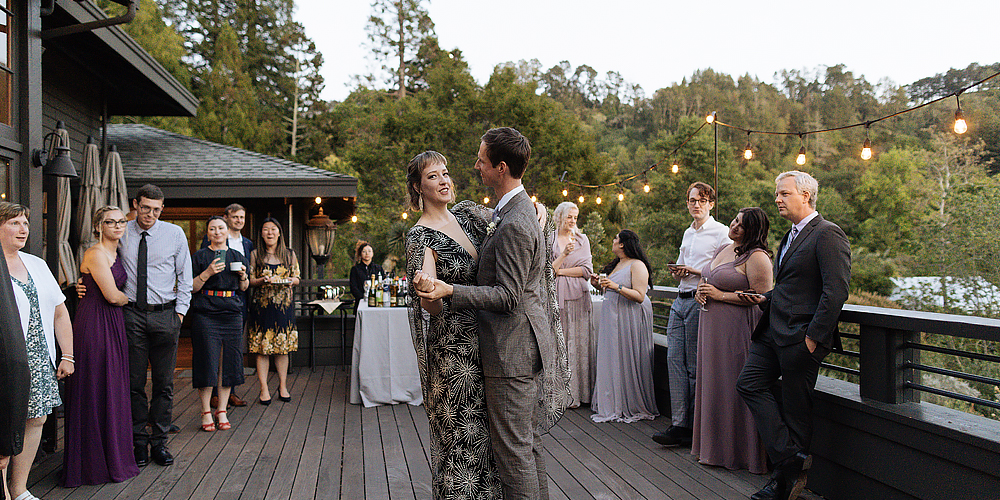 A just married couple enjoys their first dance