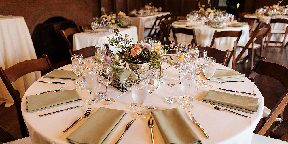 A fancy indoor party with elegant table settings