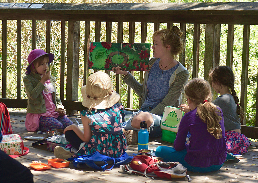 Green stuff campers being read to.