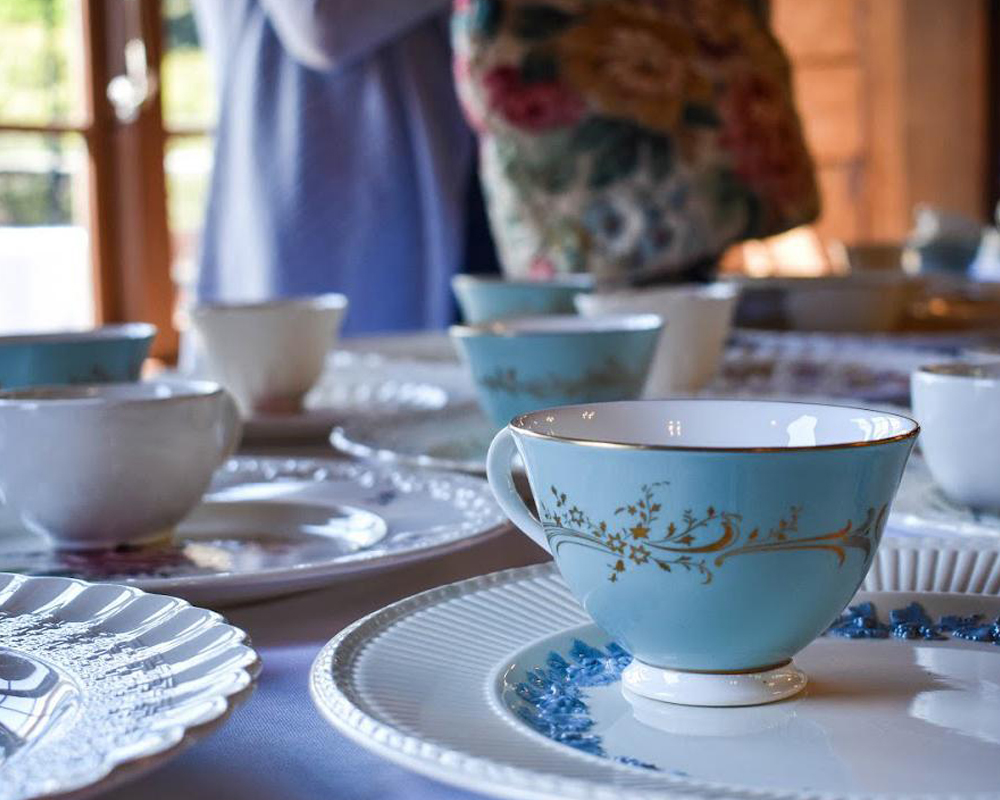 Pretty tea cups on a table ready for a party