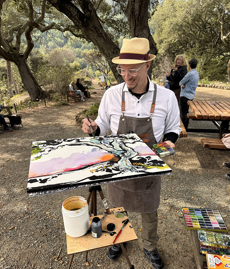 Artist Forest Stearns working on a painting on the Oak Knoll.